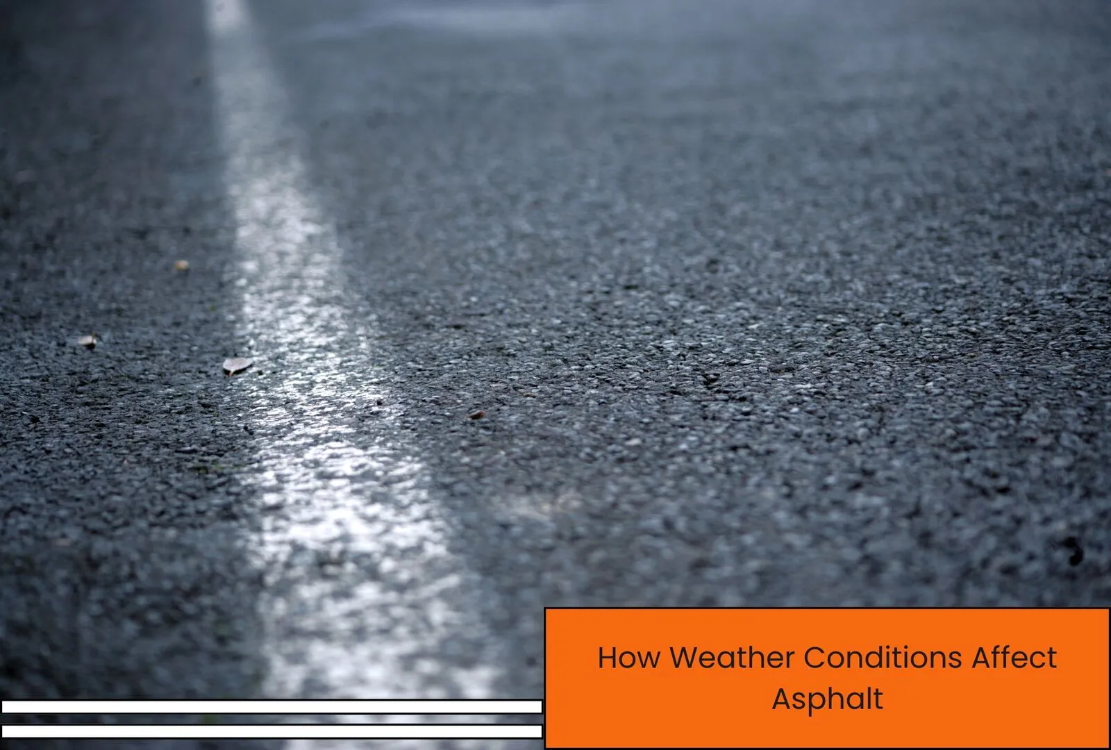 Fresh asphalt being laid on a driveway in dry weather