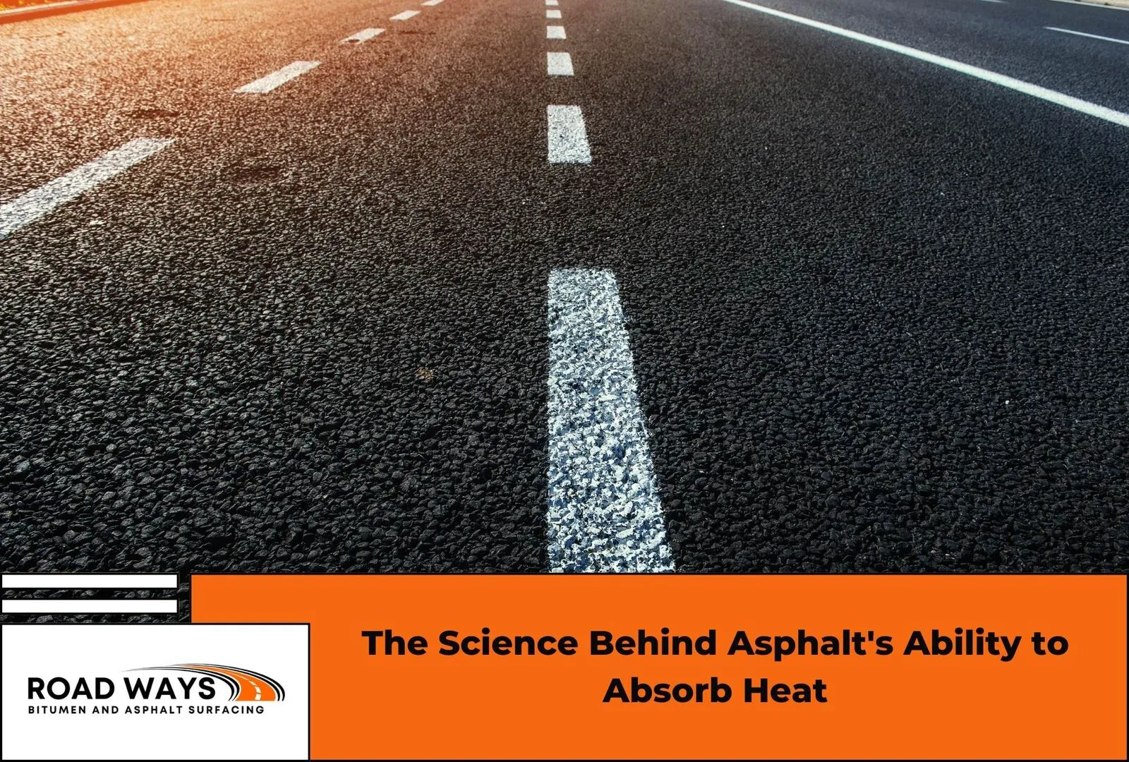 Heat shimmer rising off a dark asphalt surface in summer