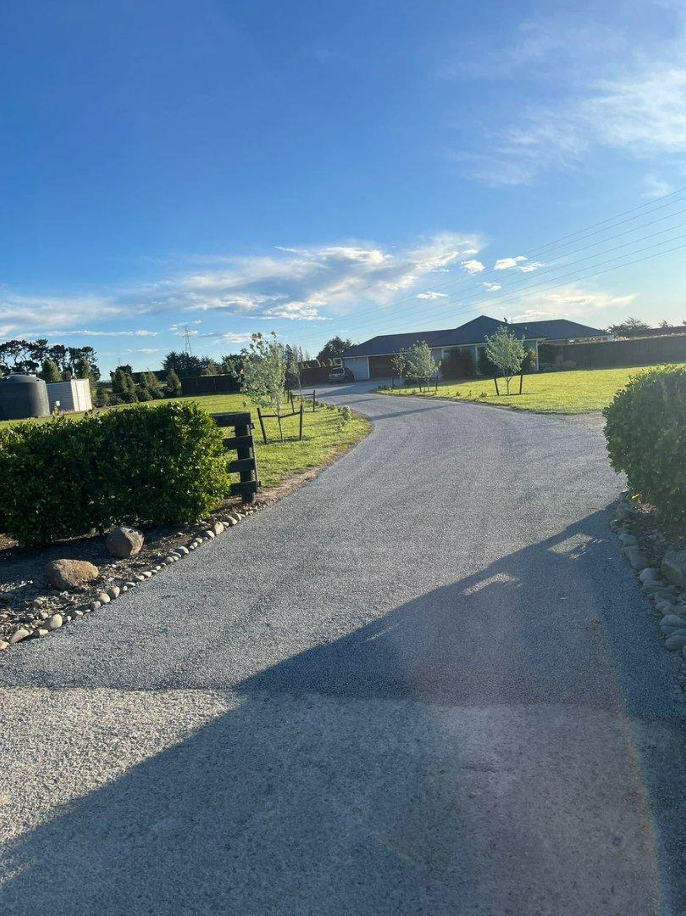 A freshly sealed driveway on a Road Ways acreage job
